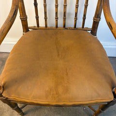 Faux Rattan Armchair with Spindle Back and X Base Stretcher Cognac Leather Pads, Sku 034151