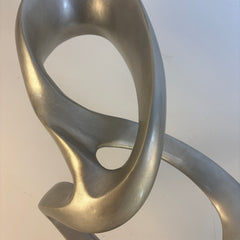 John Richard Resin Sculpture, Features Silver Tri-loop Design on Black Base, Sku 033797