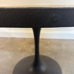 Four Hands Round Dining Table with Textured Tulip Base, Table Surface is Rough Hewn Wood Surrounded in Metal with Rivets, Sku 033836