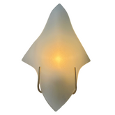 Modern wall sconce with a white, wavy design on a white background