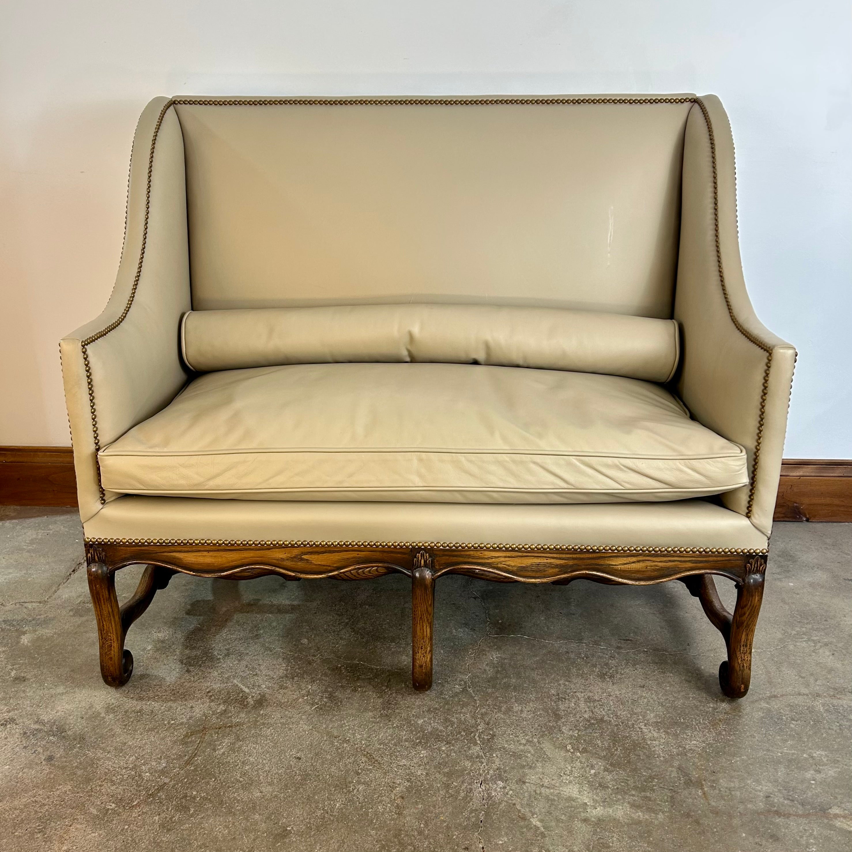 High-back Banquette or Loveseat, Cream Leather. Nailhead Trim, Slim Bolster Pillow